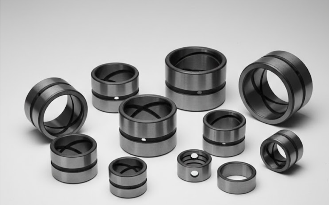 Precision-engineered Steel Groove Bushings collection with multiple lubrication patterns including Figure-8 and spiral grooves for industrial machinery.